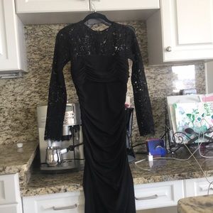 Formal dress with lace sleeves.